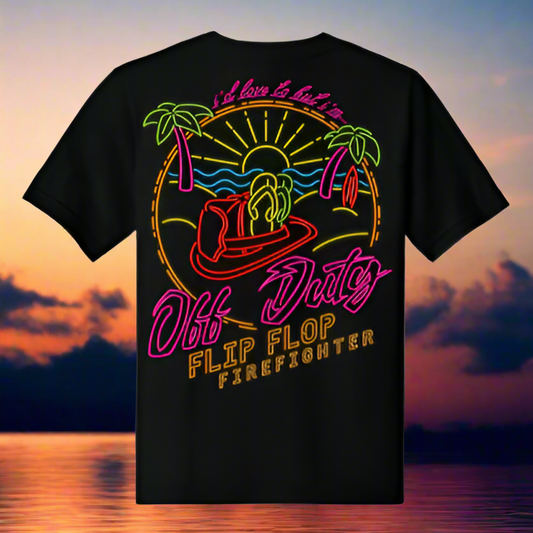 Black t-shirt with colorful graphic design of a flip flop firefighter against a sunset over water background