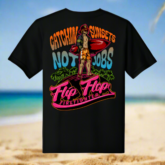 Black t-shirt with colorful graphic design on a beach background