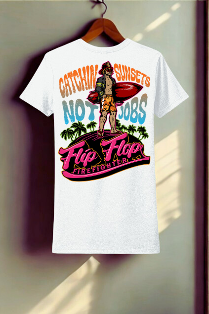 White t-shirt with colorful graphic design on a hanger against a neutral background