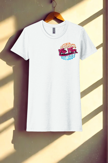 White t-shirt with colorful text design on a wooden hanger against a light background
