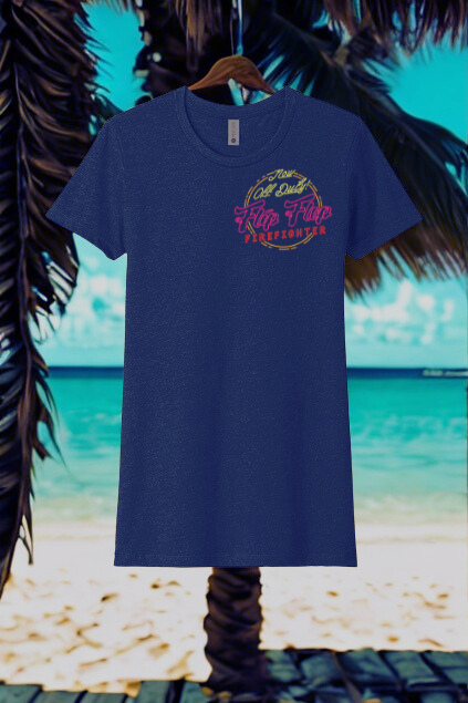 Blue t-shirt with colorful text on a hanger against a beach background