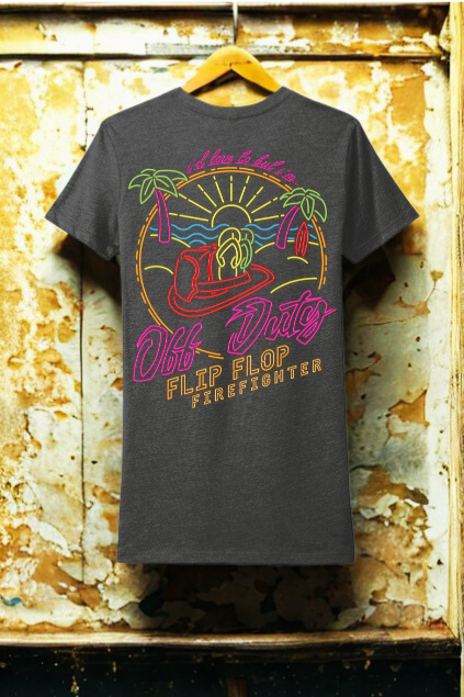Black t-shirt with colorful graphic design on a textured yellow background