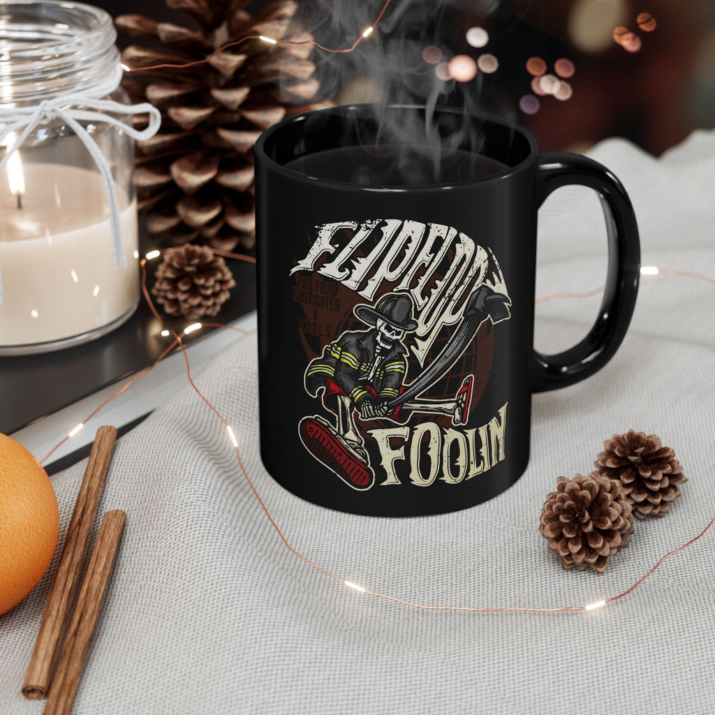 Flip Flop Firefighter glossy black ceramic coffee mug featuring a skeleton firefighter graphic with Flippin Foolin text