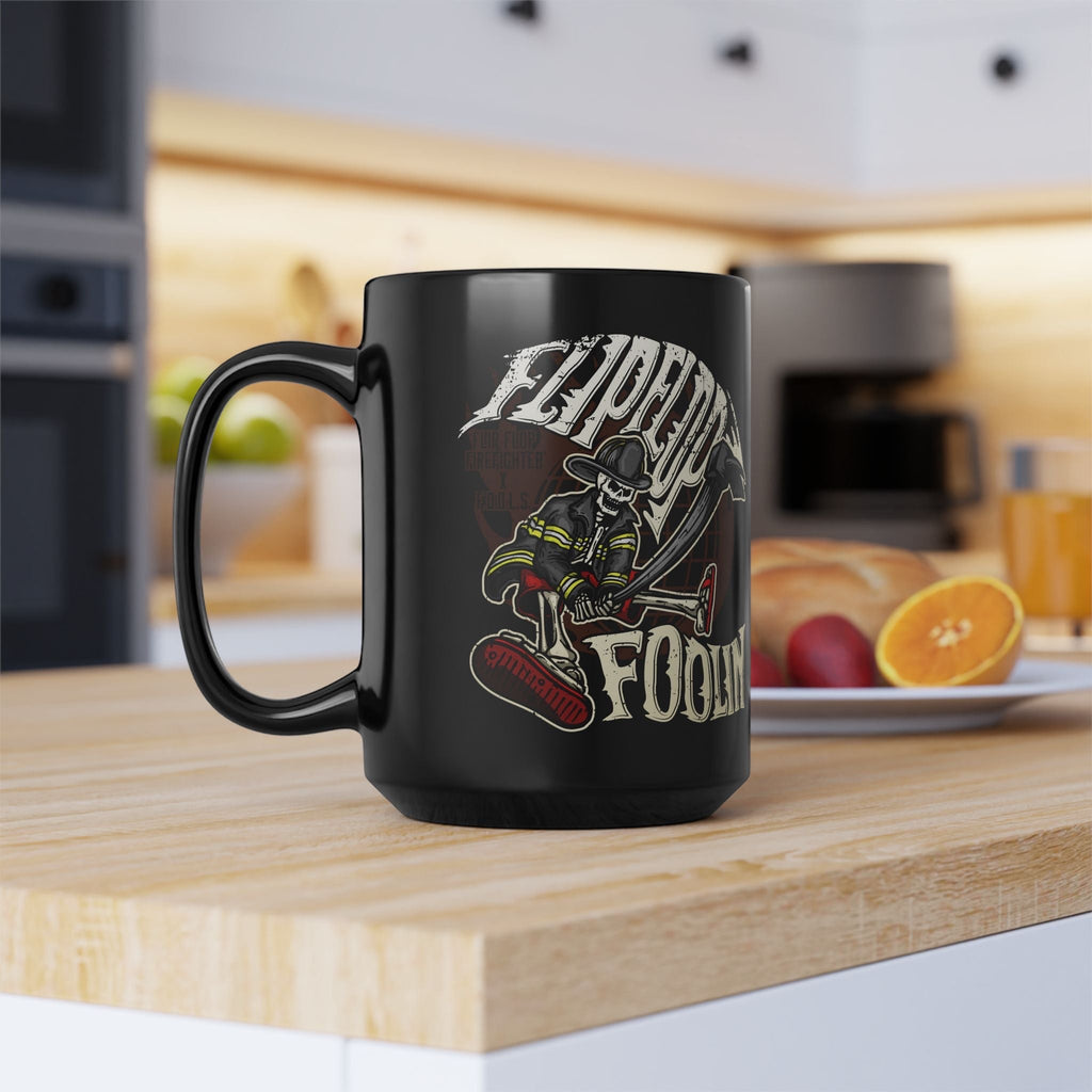 Flip Flop Firefighter glossy black ceramic coffee mug featuring a skeleton firefighter graphic on a kitchen counter.