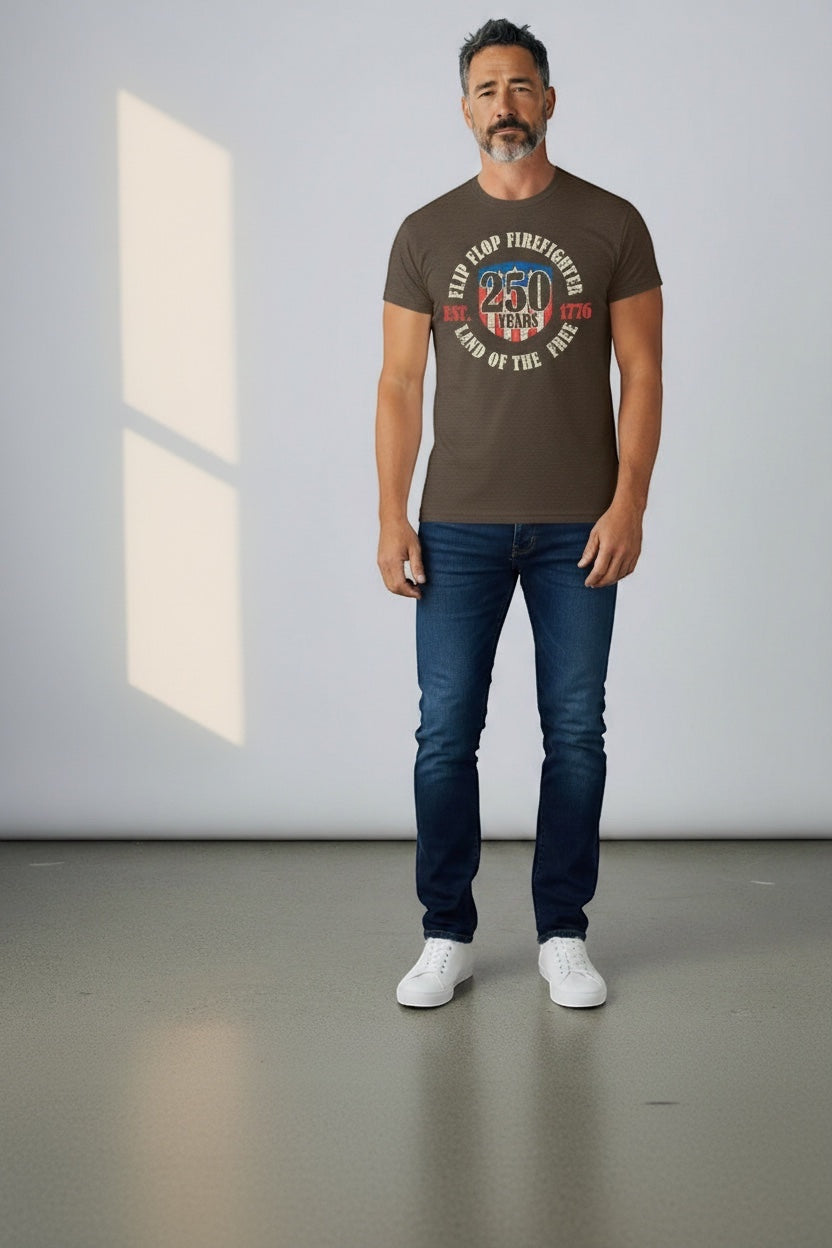 Flip Flop Firefighter brown graphic t-shirt with 250 years American flag design worn by a man with blue jeans.