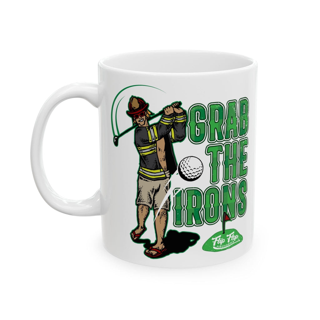 Flip Flop Firefighter white ceramic coffee mug featuring a cartoon firefighter playing golf with Grab The Irons text.