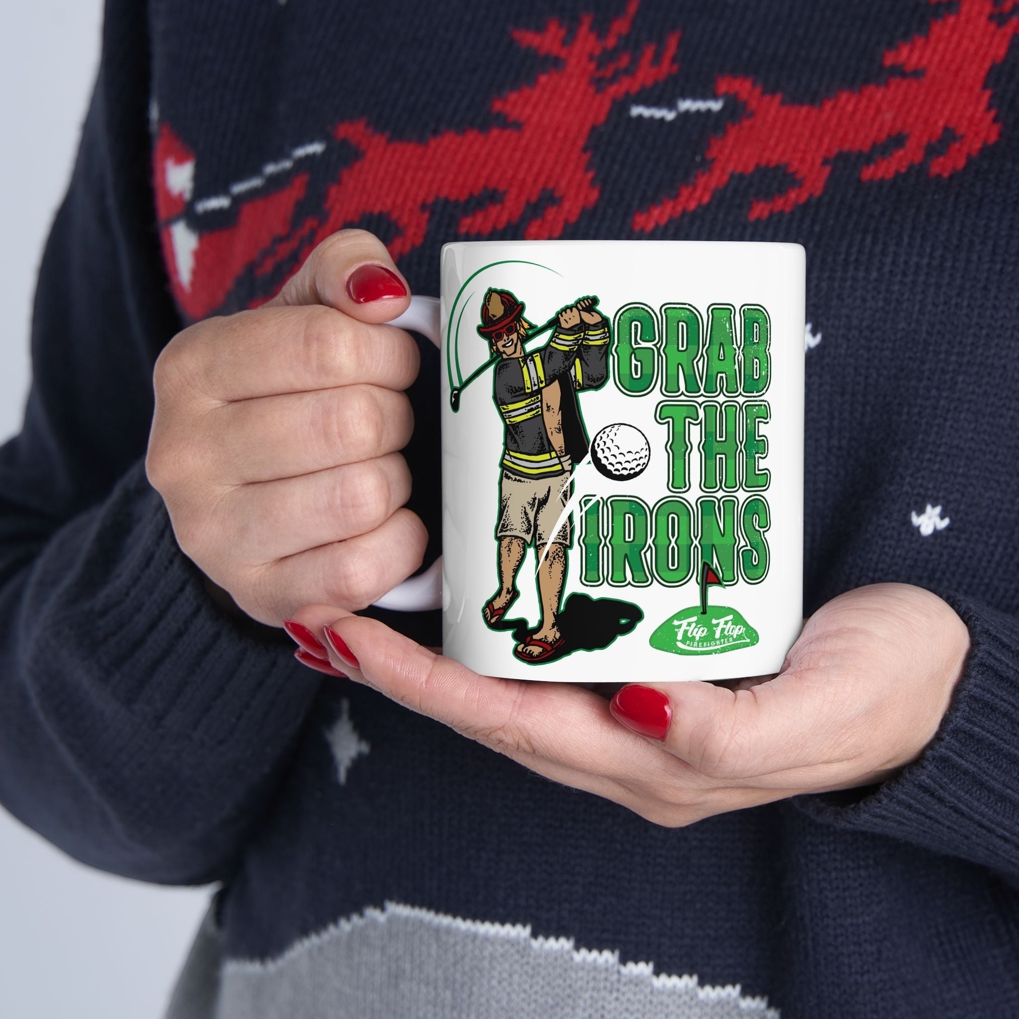 Flip Flop Firefighter white ceramic coffee mug featuring a firefighter golfing graphic and Grab The Irons text.