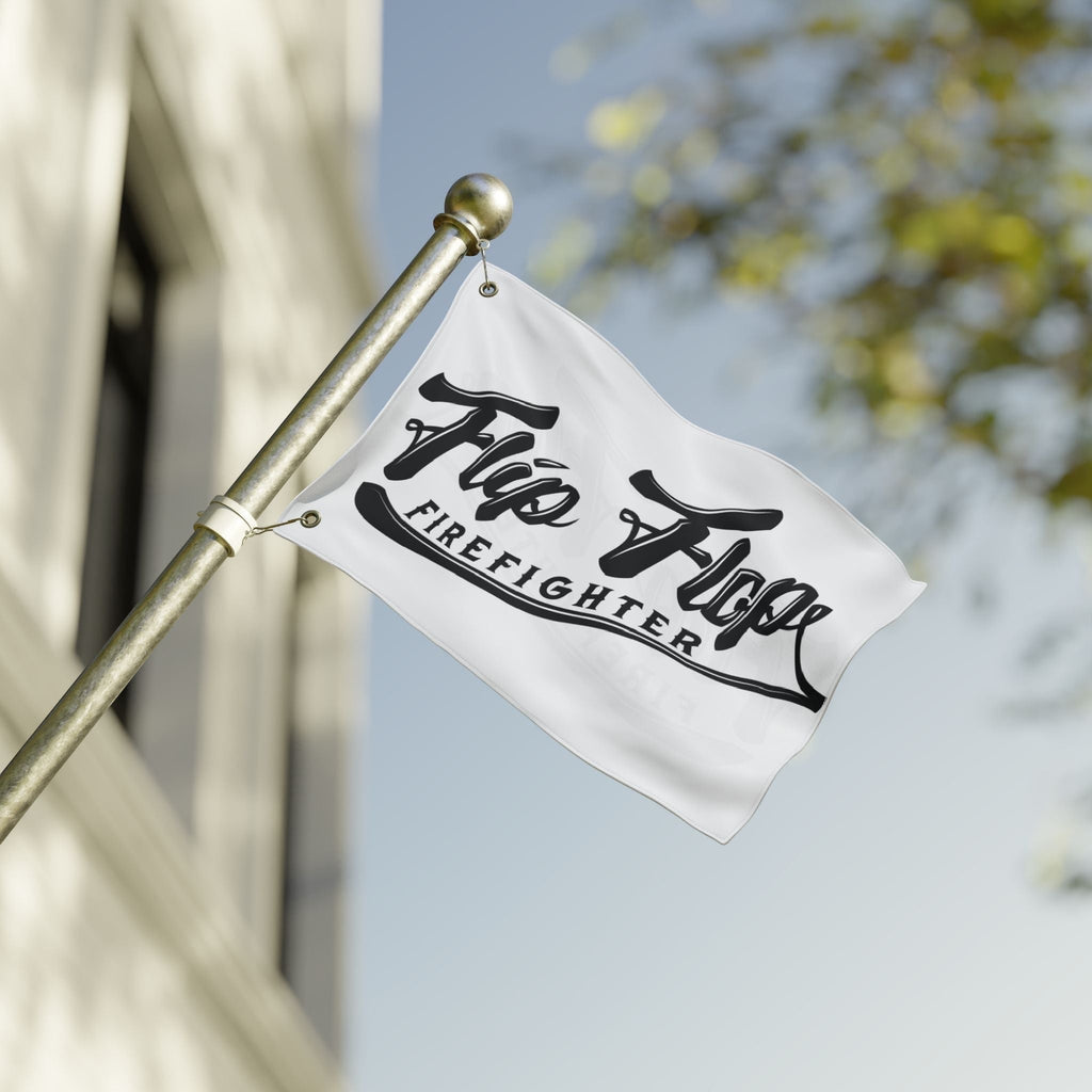Flip Flop Firefighter The OG flag with black logo on white polyester fabric, hanging on a metal pole outdoors.