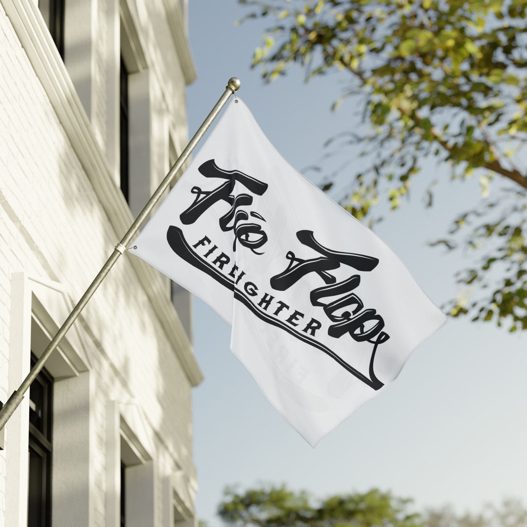 Flip Flop Firefighter The OG Flag featuring a bold black logo on a white polyester fabric hanging from a pole