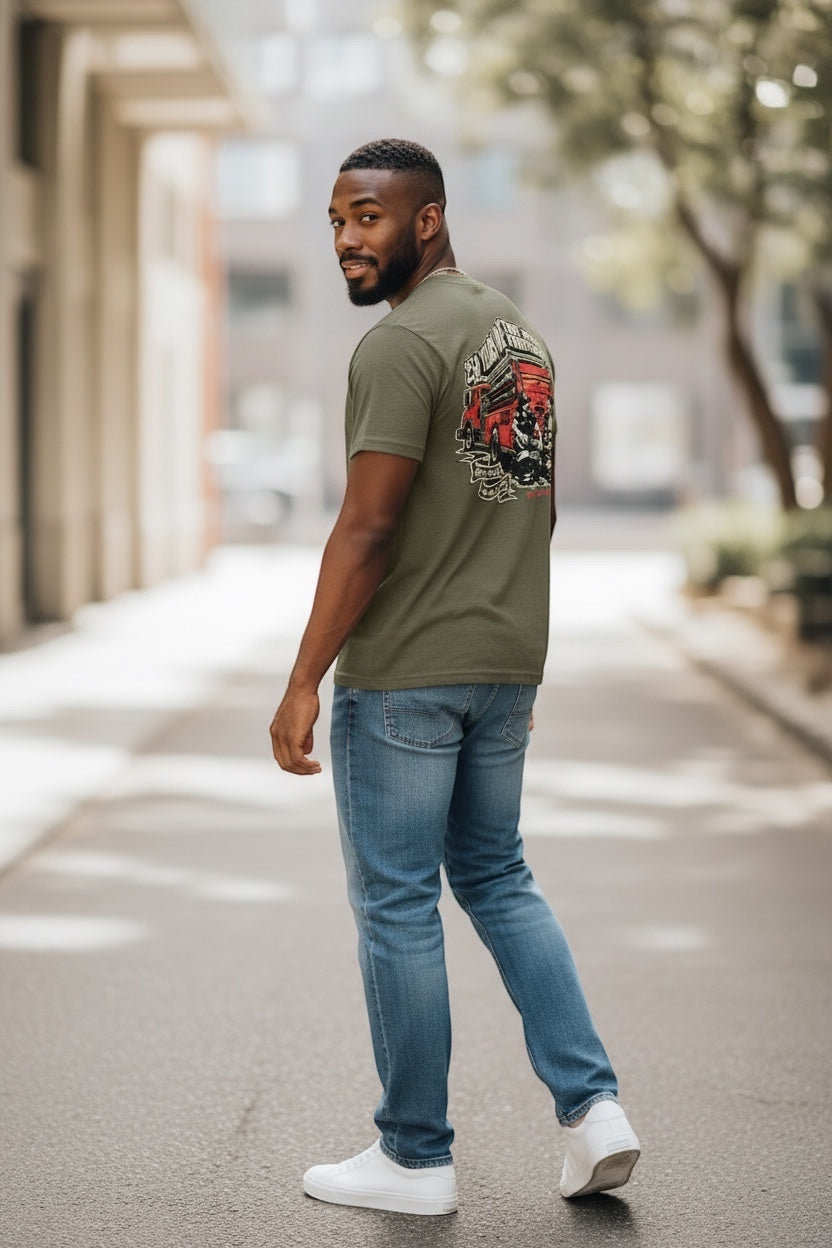 Flip Flop Firefighter olive green graphic t-shirt with vintage fire truck design worn by a man in jeans
